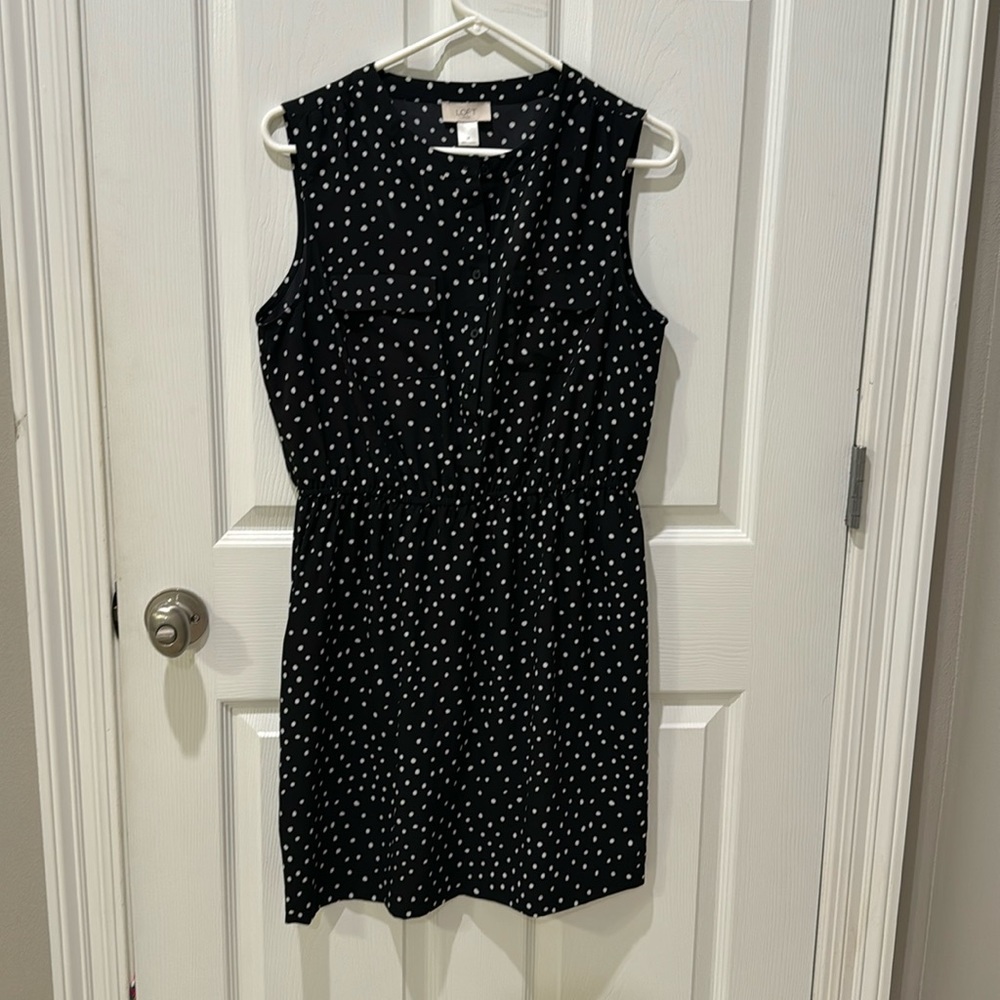 Black and white polka dot sleeveless dress